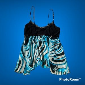 Very cute short flowy blouse, very delicate materiel ends at the waist.